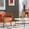 Fauteuil design en tissu effet velours texturé terre brûlée et métal noir LAURENS