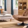 Fauteuil pivotant en cuir marron et métal noir HUXLEY